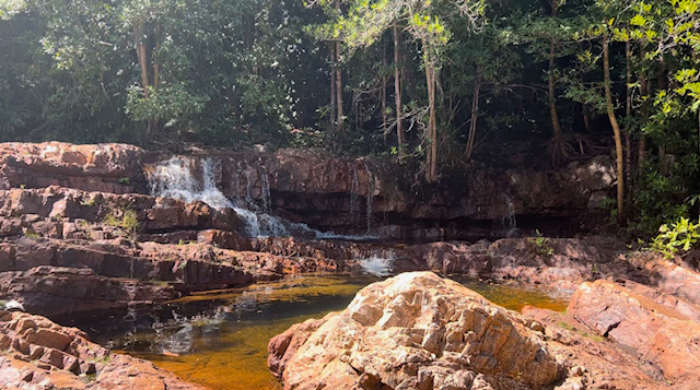 Waterfall on red rock at Lower Cascades in Litchfield National Park